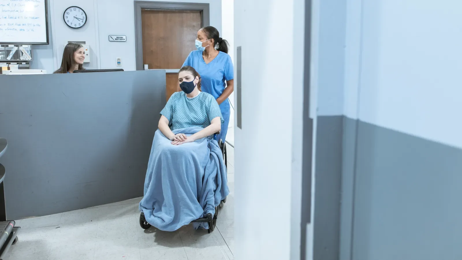 Medical escort assisting a patient during an organized journey